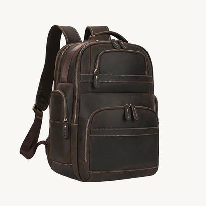 Brown leather backpack on a white background