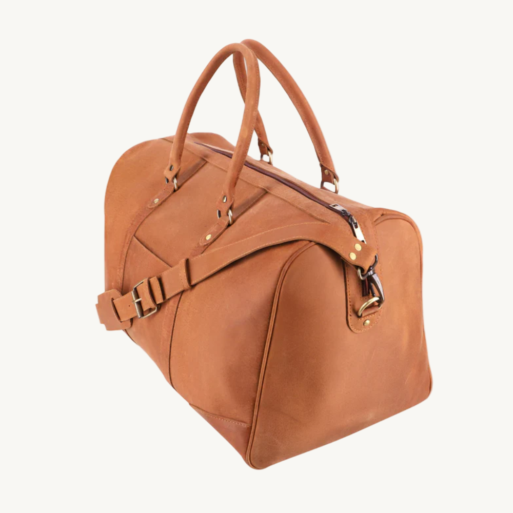 Brown leather duffel bag on a white background