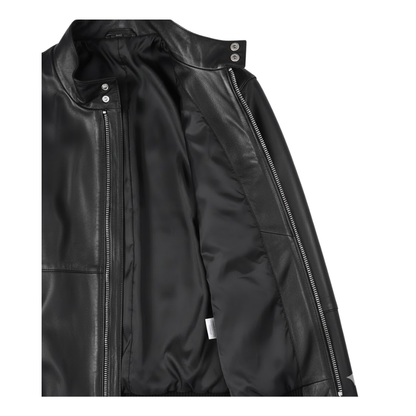 Internal view of a men's black lambskin leather bomber jacket showing the soft lining and pockets