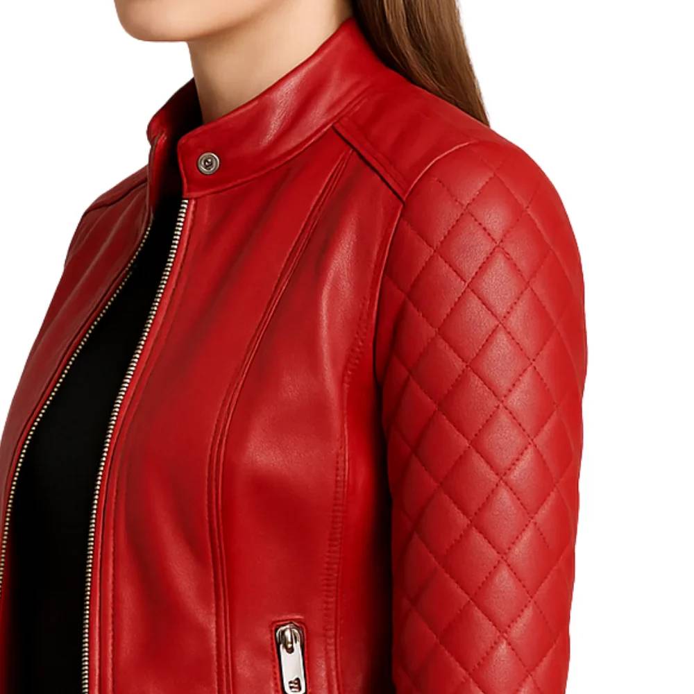 Women’s red quilted lambskin leather café racer jacket with shoulder quilting, asymmetrical left-side zipper, and a snap button collar.